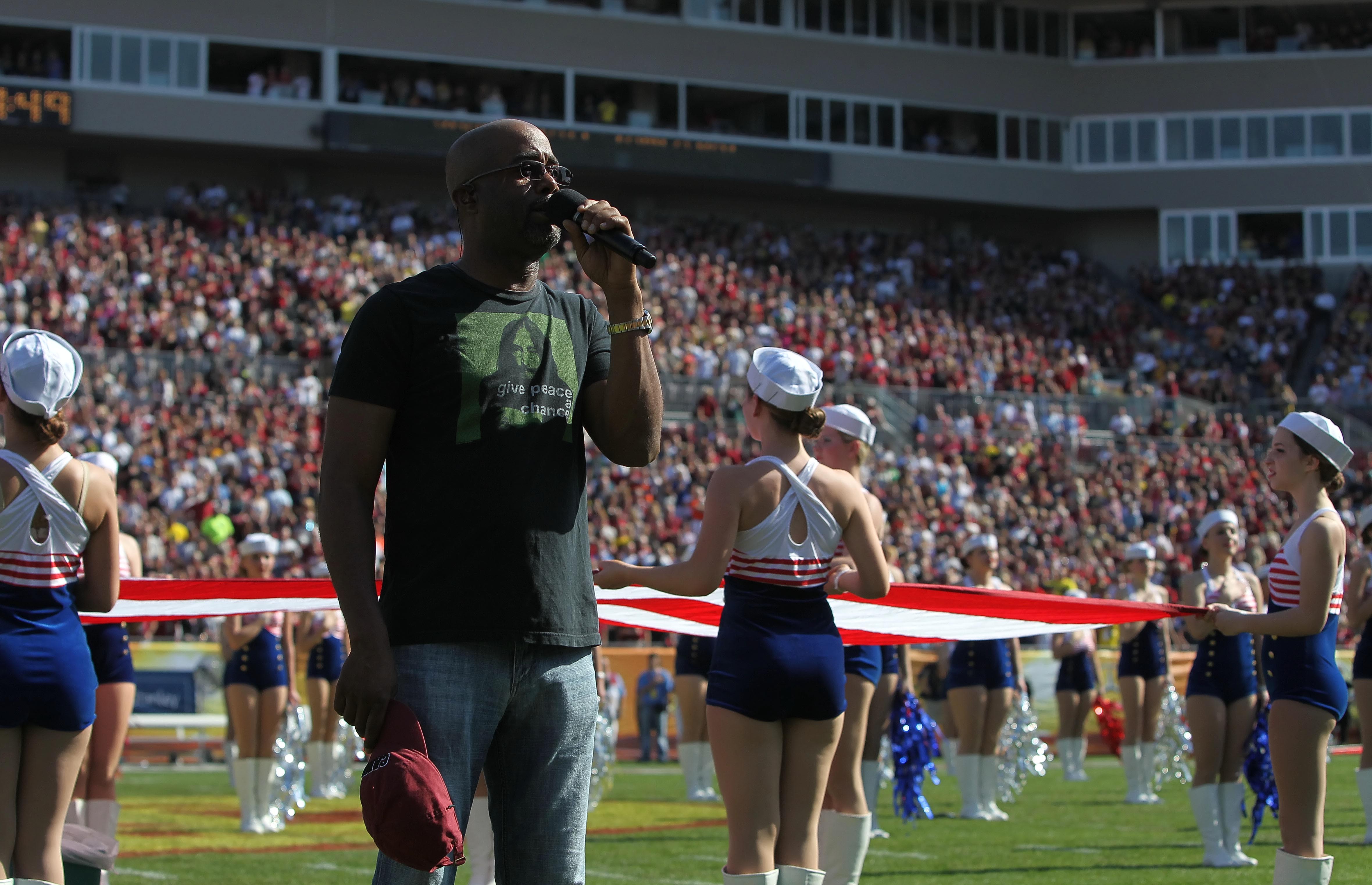 An image of Darius Rucker singing the National Anthem is projected